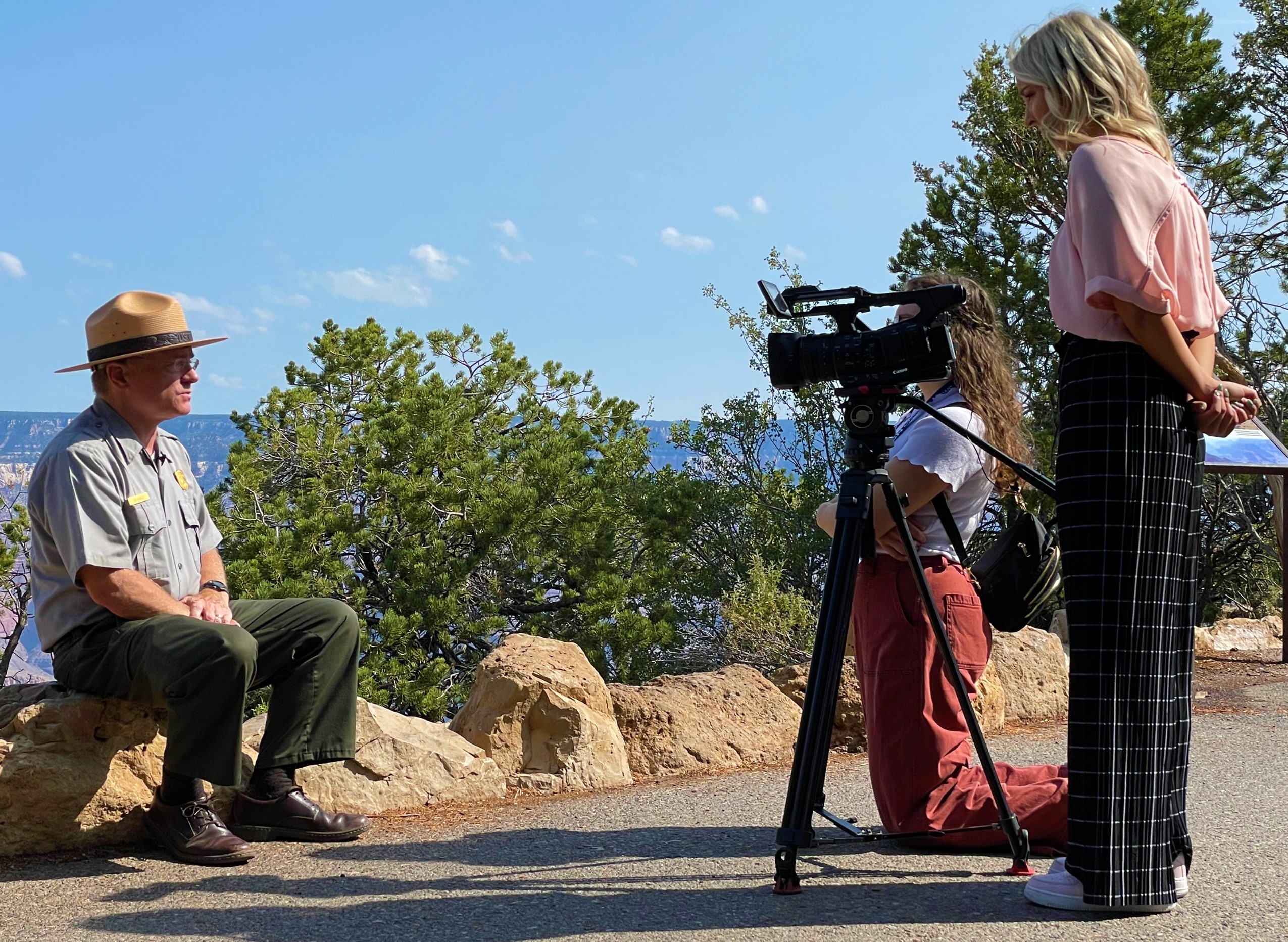 Two reporters film and interview Grand Canyon Superintendent, Ed Keable