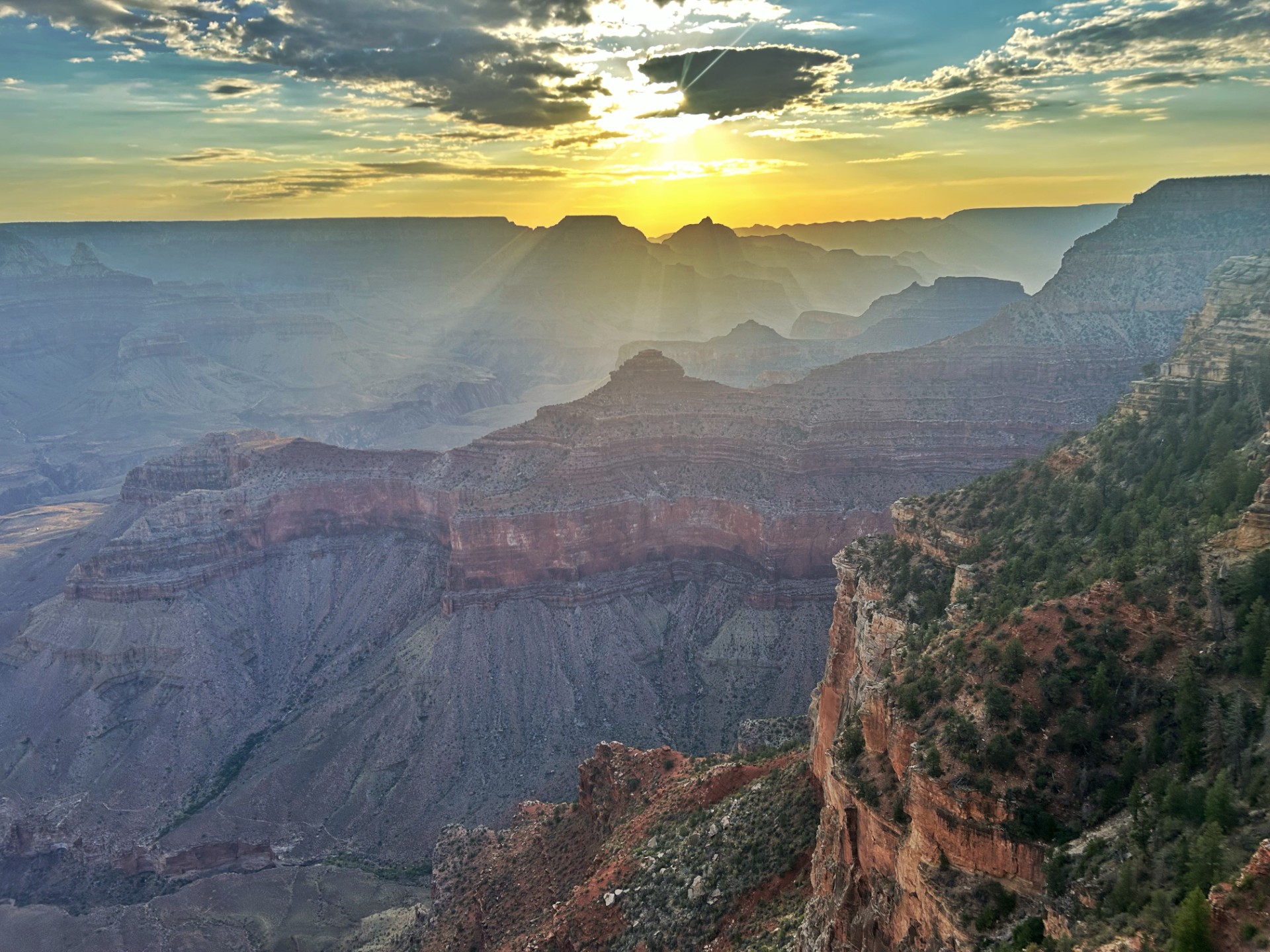 Sunrise with clouds and a canyon landscape