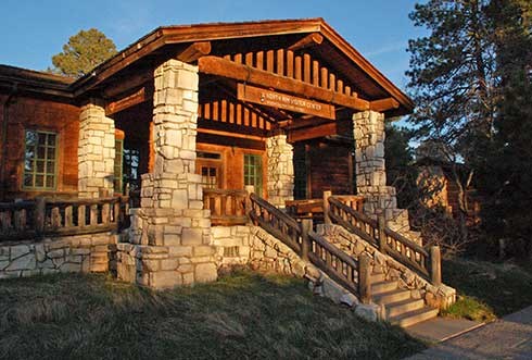 Flight of stairs leads up to front entrance of rustic North Rim visitor center.