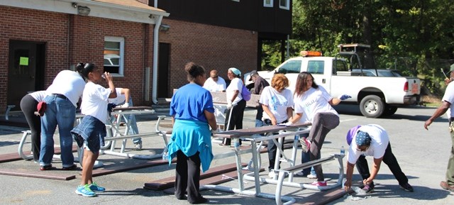 Volunteer assembling a picnic table
