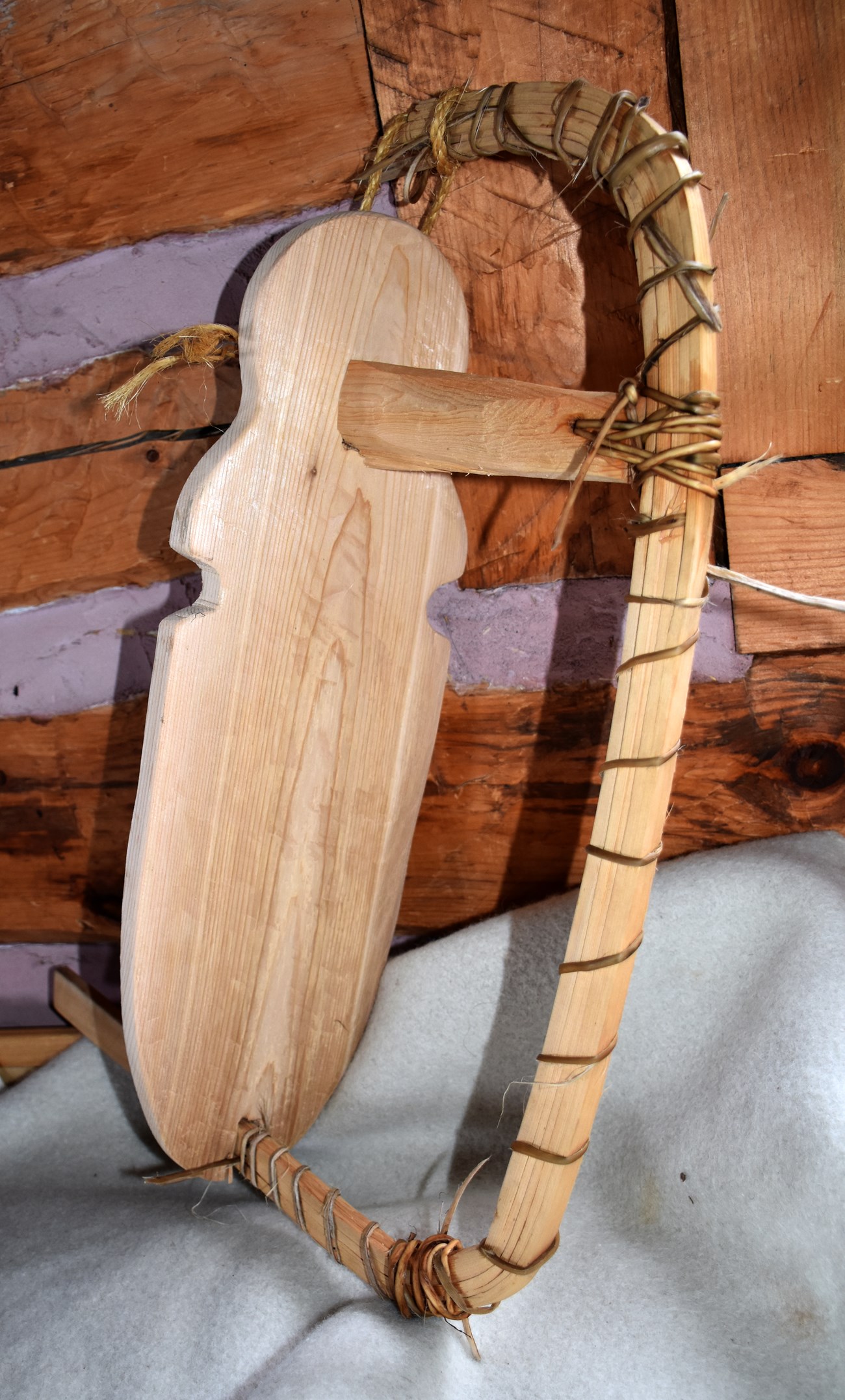 A bent cedar form to shape the bow or stern of the canoe.