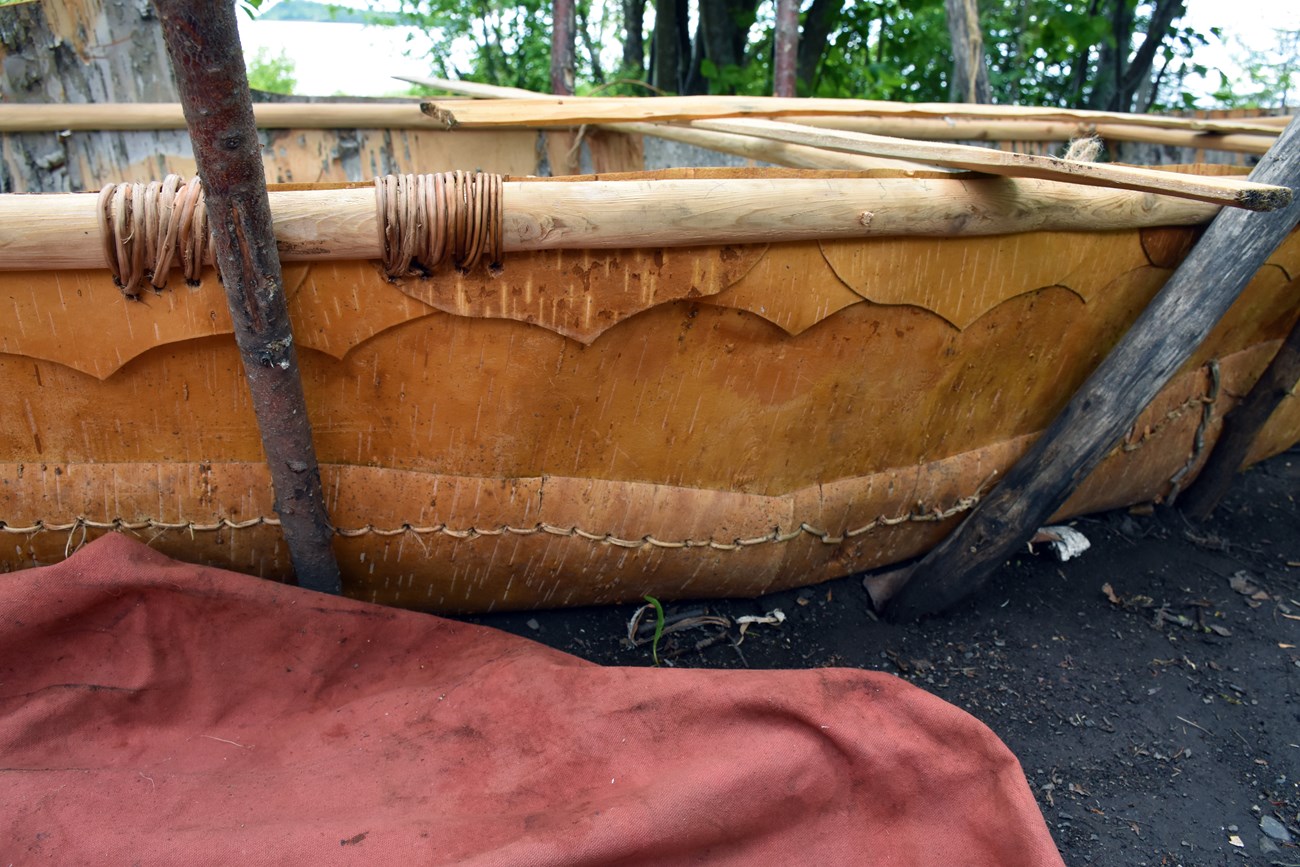 Detail of decorative grommets along the gunwale.