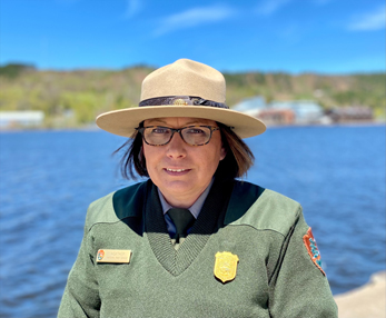 Head and shoulders of a person wearing a National Park Service uniform.