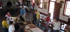Visitors talk with an interpreter inside the Great Hall.