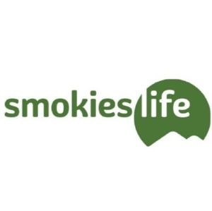 smokies life logo with text and green mountain behind the word life