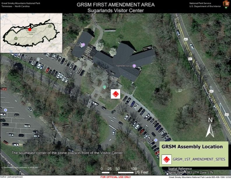 Sugarlands Visitor Center 1st Amendment Area map. Red diamond in white square in southeast corner of stone plaza in front of visitor center. Parking lot, cars and trees visible on map. Inset park map in corner. Scale: 1.75 in = 100 ft