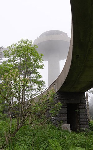 A view of the observation tower in the fog, taken from the base of the tower.