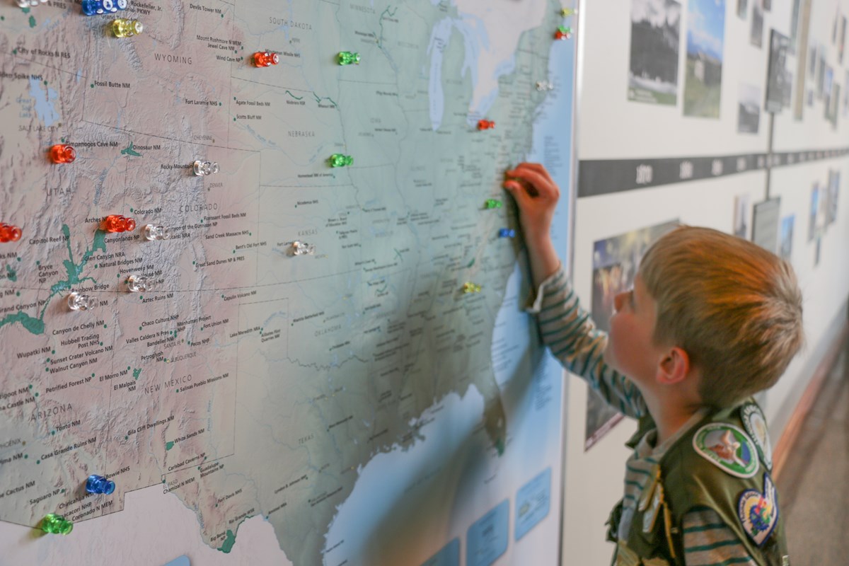 Junior Ranger interacting with a map