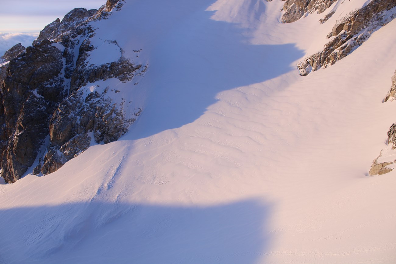 View from above of Middle Teton Glacier. The bowl of Middle Teton is filled with winter snow.