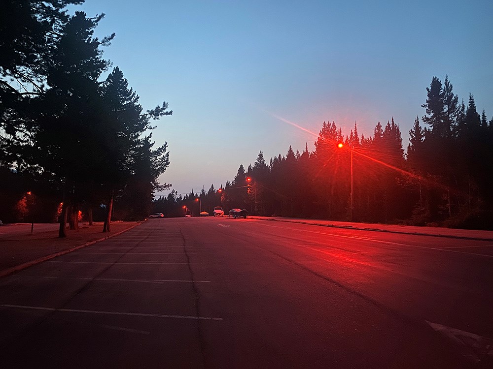 The wildlife friendly lights illuminate the Colter Bay parking lot