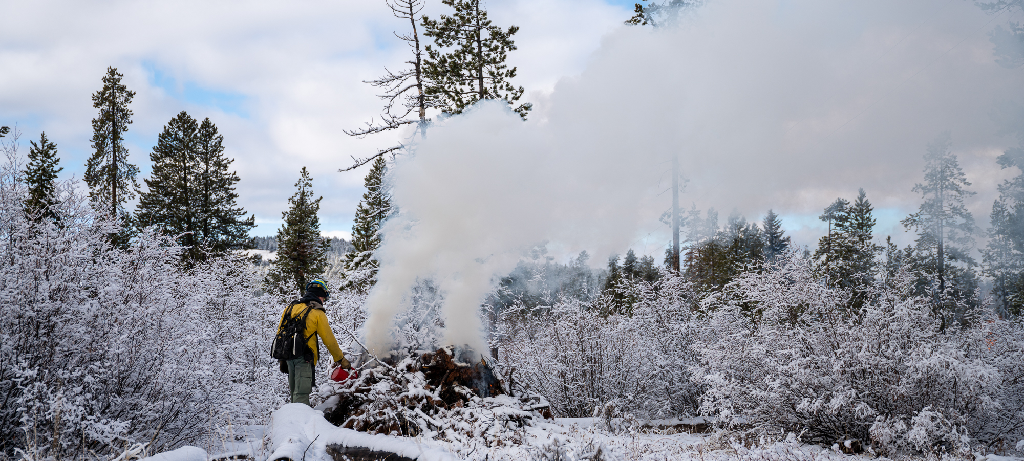 Fire personnel burning pile