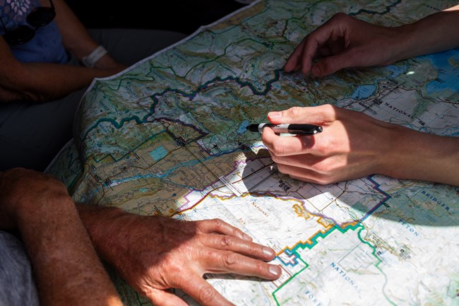 Ranger marking a visitor's map