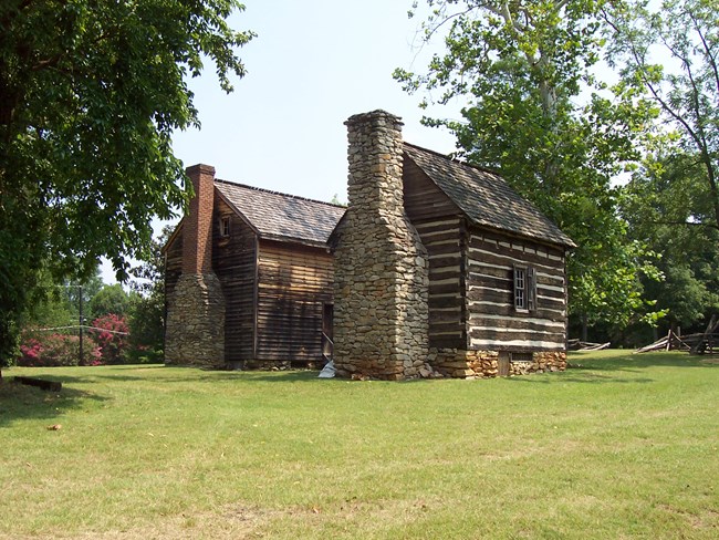 18th century southern colonial clapboard house and log kitchen