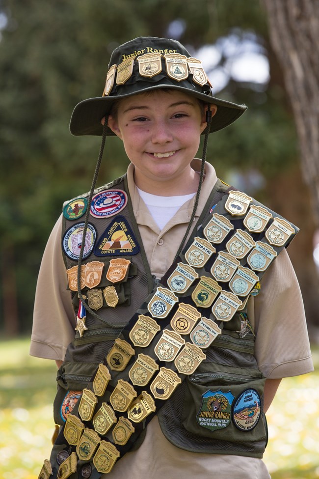 Boy with badges on a vest