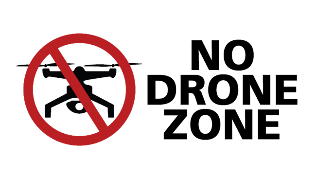 Text reading "No Drone Zone" and a red circle and line through the drawing of a drone