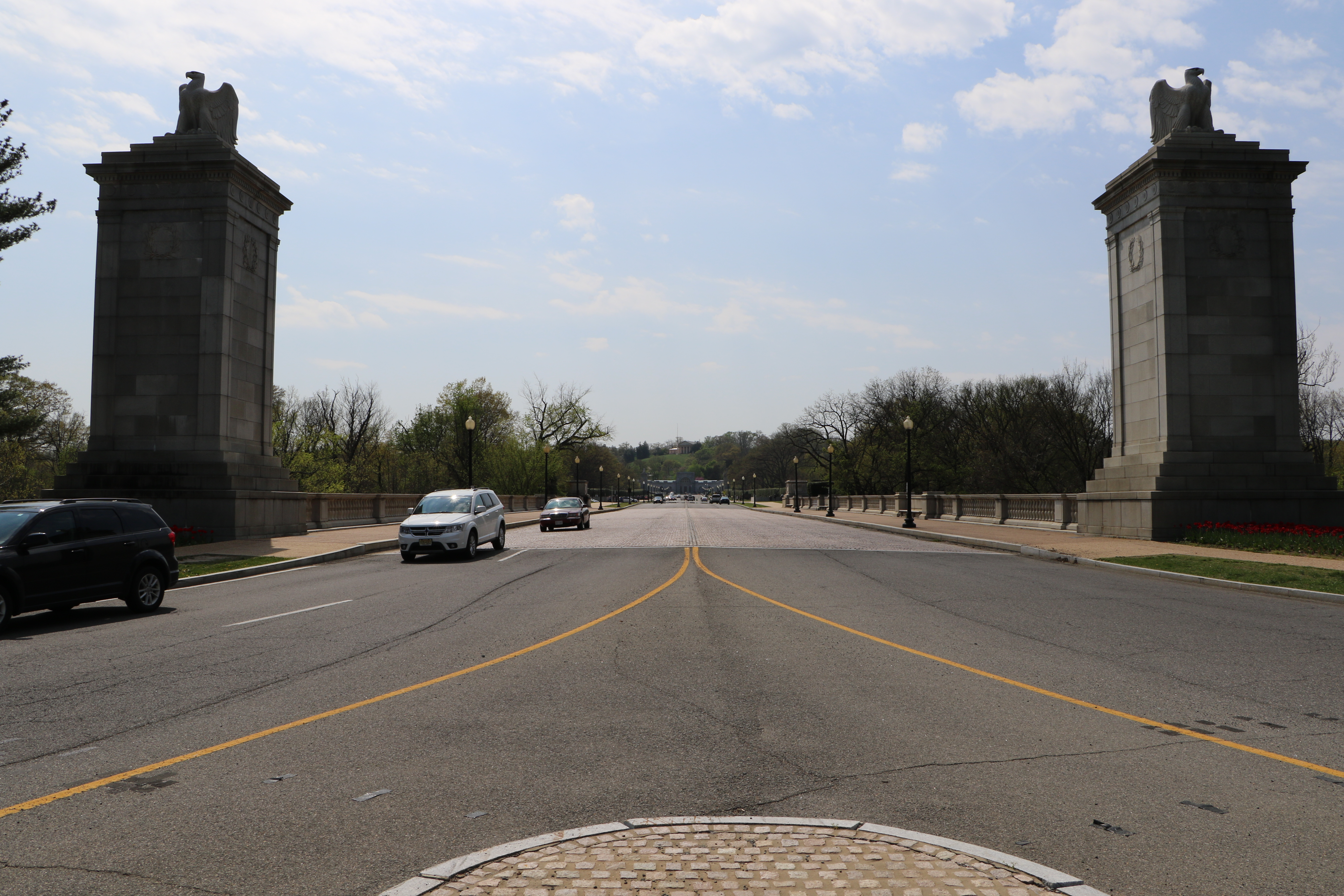 Cars drive beneath the iconic eagles on the George Washington Memorial Parkway.