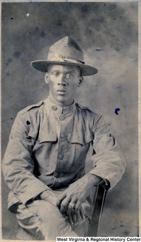 closeup photo of an African American man, seated, wearing his World War I uniform