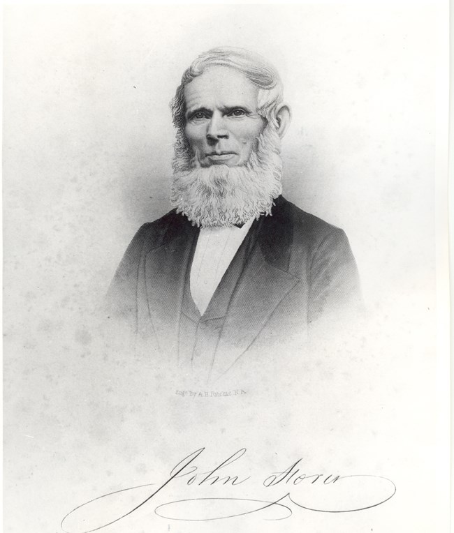 engraving of John Storer; white haired, bearded man wearing a suit; head and upper body image; his signature is at the bottom