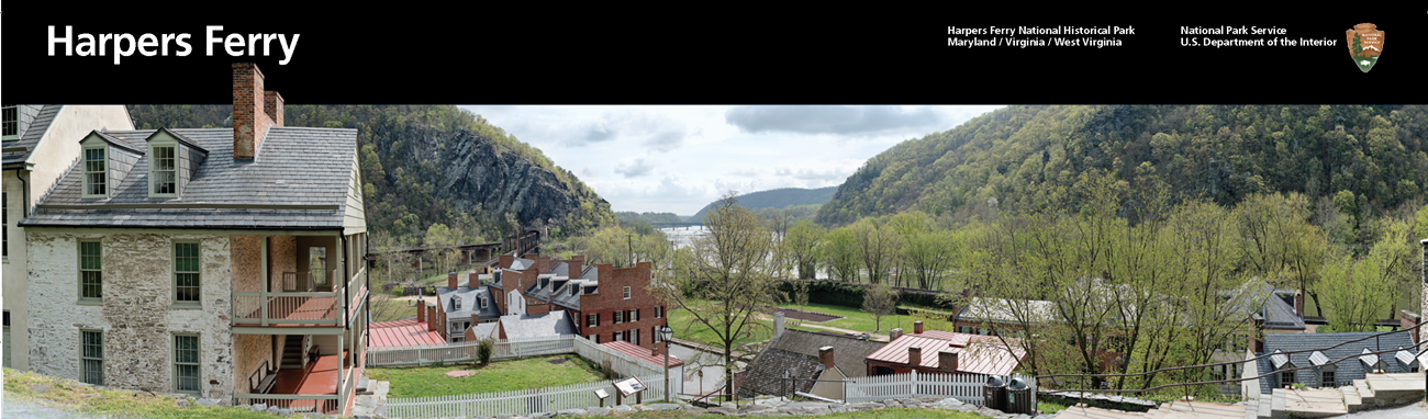 Cover of the Harpers Ferry national park brochure showing old house on the left and a view of the water gap in the blue ridge.