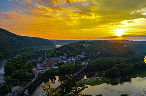 view of Harpers Ferry from Maryland Heights; at sunset, in the late summer