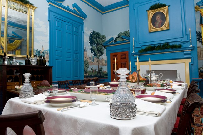 Modern day photo of the dining room set for entertaining.