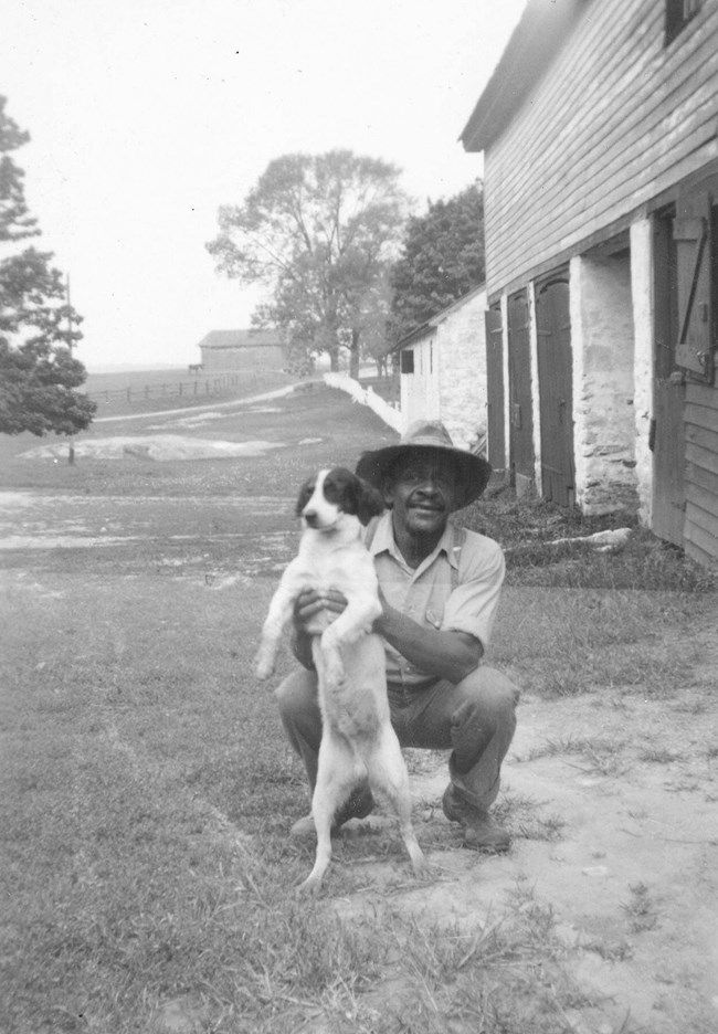 Photograph of Howard and farm dog Joe Louis, 1936, NPS