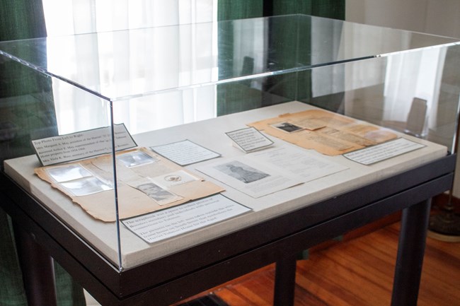 A display case with large scrapbook pages