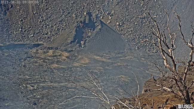 Dark crater with black cinder cone inside