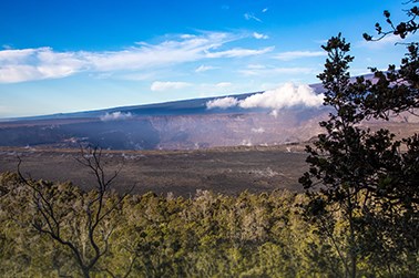 Volcanic caldera with trees in the foreground