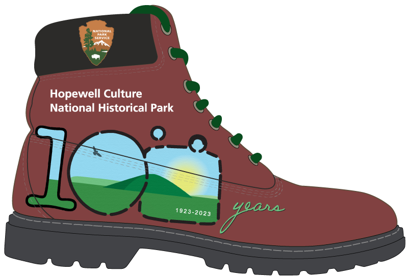 A hiking boot with the park's centennial logo on the side of it with text reading "years" to the right of the 100 logo