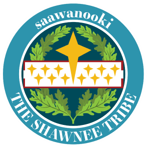 seal depicts a field of blue an oak leaf laurel overlayed with a white band containing 12 yellow four point stars and matching yellow star on the top half of the emblem. text saawanooki and The Shawnee Tribe on outer band.