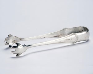 Silver sugar tongs monogramed with FDR.