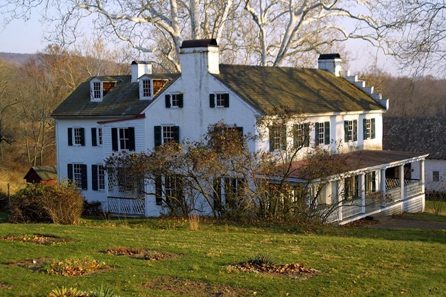 White home with 4 floors and 19 rooms.