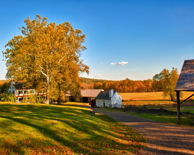 View of Hopewell Furnace from upper village on a fall day.