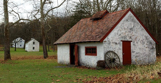 White stone building with red tile roof served as a blacksmith shop near French Creek.