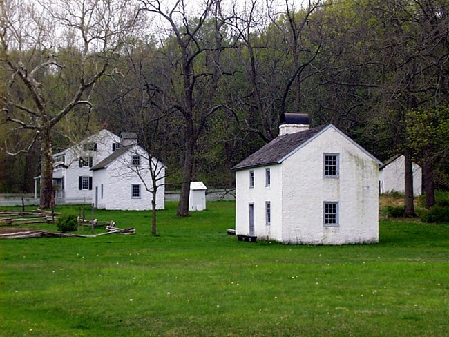 White stone houses served as workers houses at Hopewell Furnace.