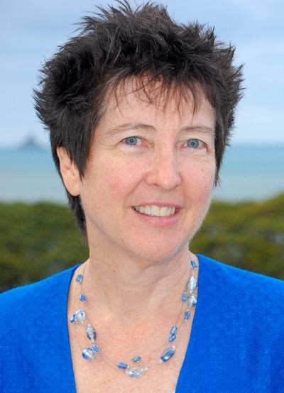 A woman with short hair smiling