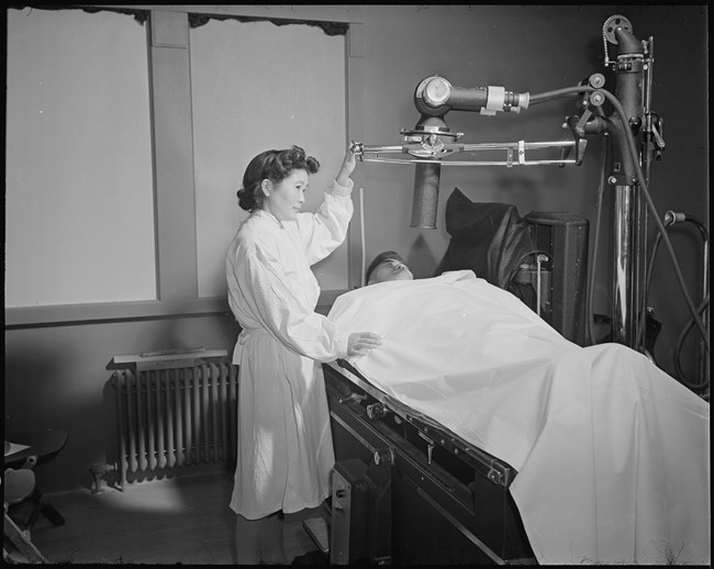 A Japanese woman giving an X Ray to a patient