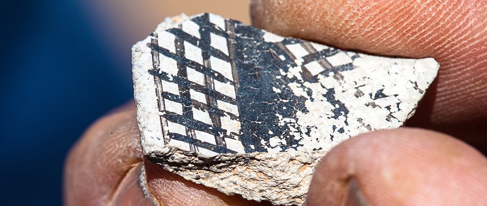 a piece of black and white patterned pottery