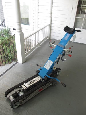 A photograph on the back porch of the Truman Home shows a machine known as a Stair Trac, used to transport wheelchairs up and down the stairs.