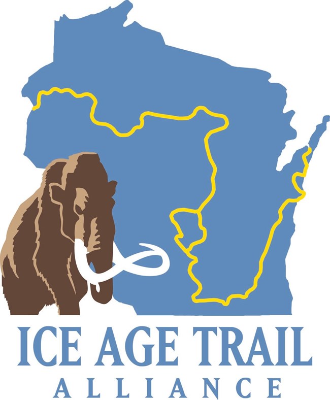 Illustration of mammoth over outline of Wisconsin logo.