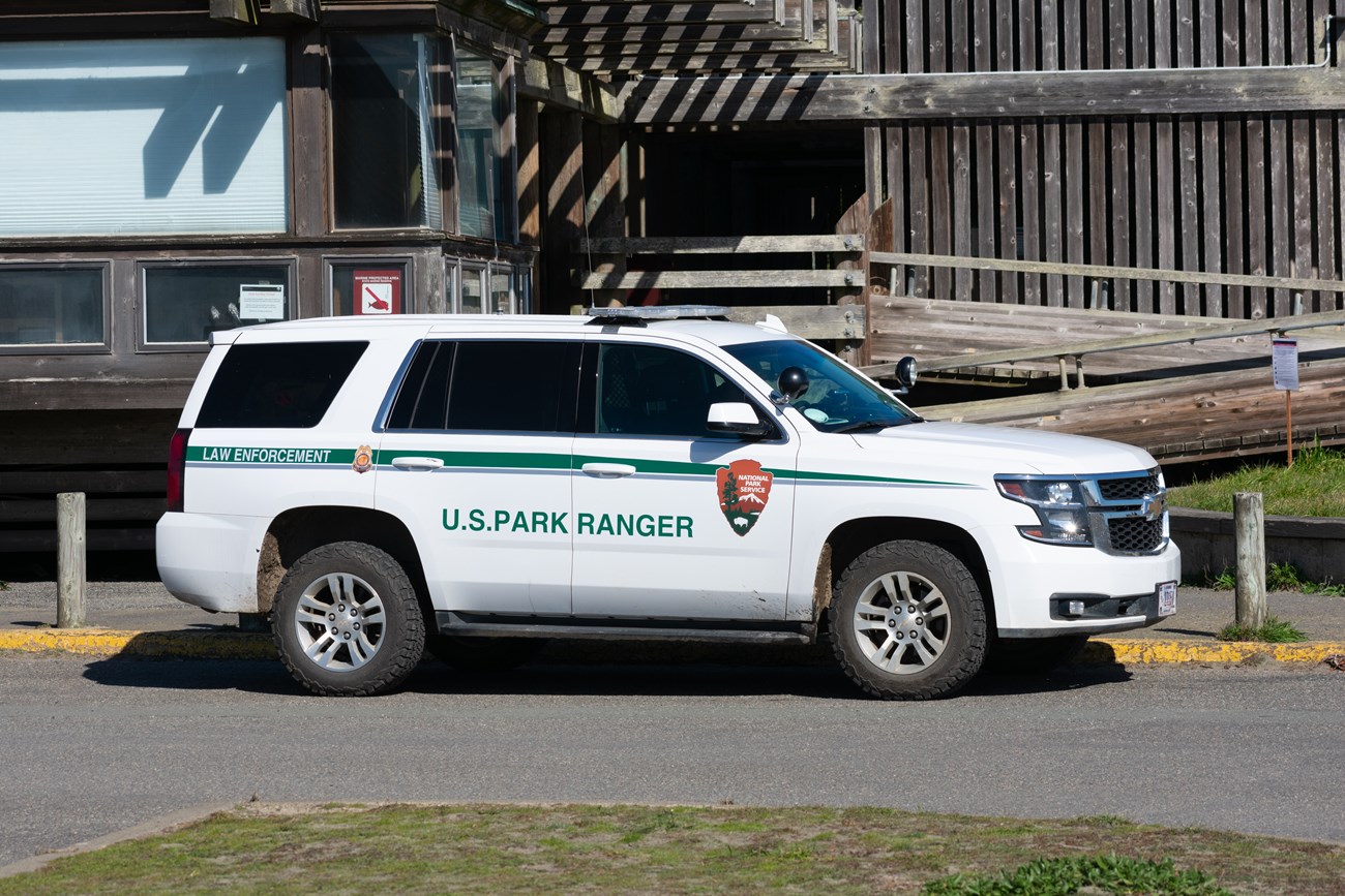 Photograph of a National Park Service white SUV.