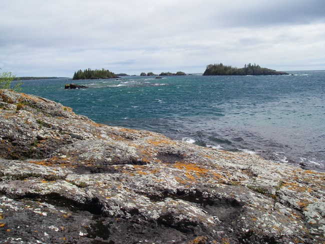 Lichen-covered rock and Lake Superior