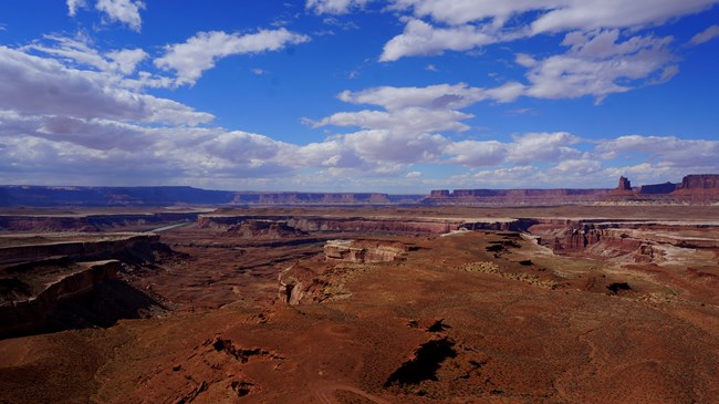 Vast canyon landscape and bright blue sky