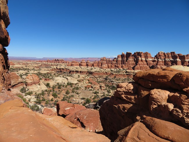Red rock landscape with sedimentary layers visible in rock formations