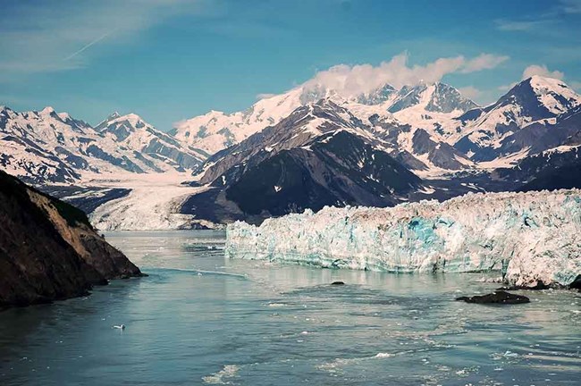 Hubbard Glacier, a tidewater glacier, meets the sea in its rocky fjord.
