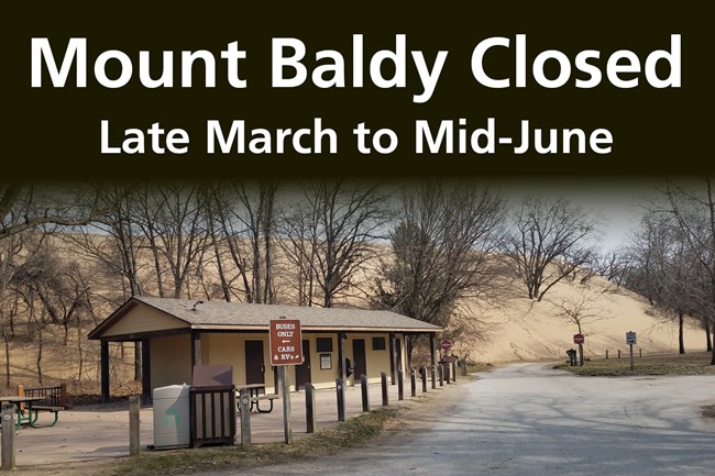 Mount Baldy closure image showing the comfort station with a sand dune behind it.