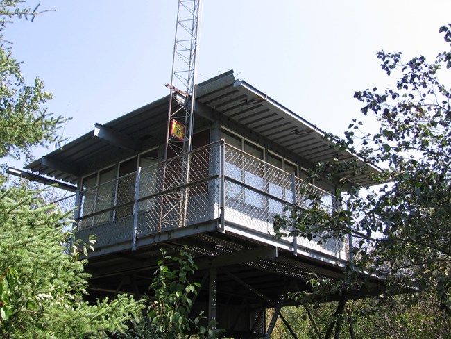 A gray metal structure known as a fire tower.