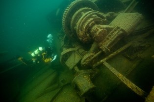 A diver exploring the shipwreck Emperor.