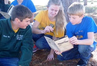 Youth work together on completing Wilderness Ranger booklet